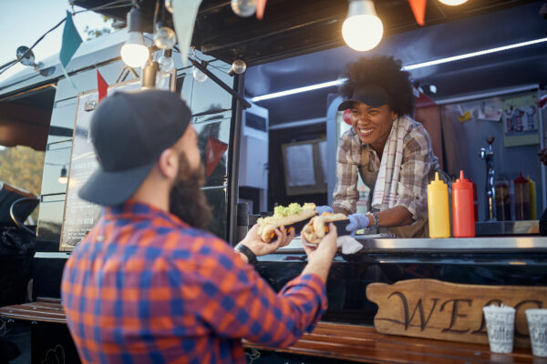 Polite,Afro-american,Female,Employee,Holding,,Giving,,Two,Sandwiches,To,A